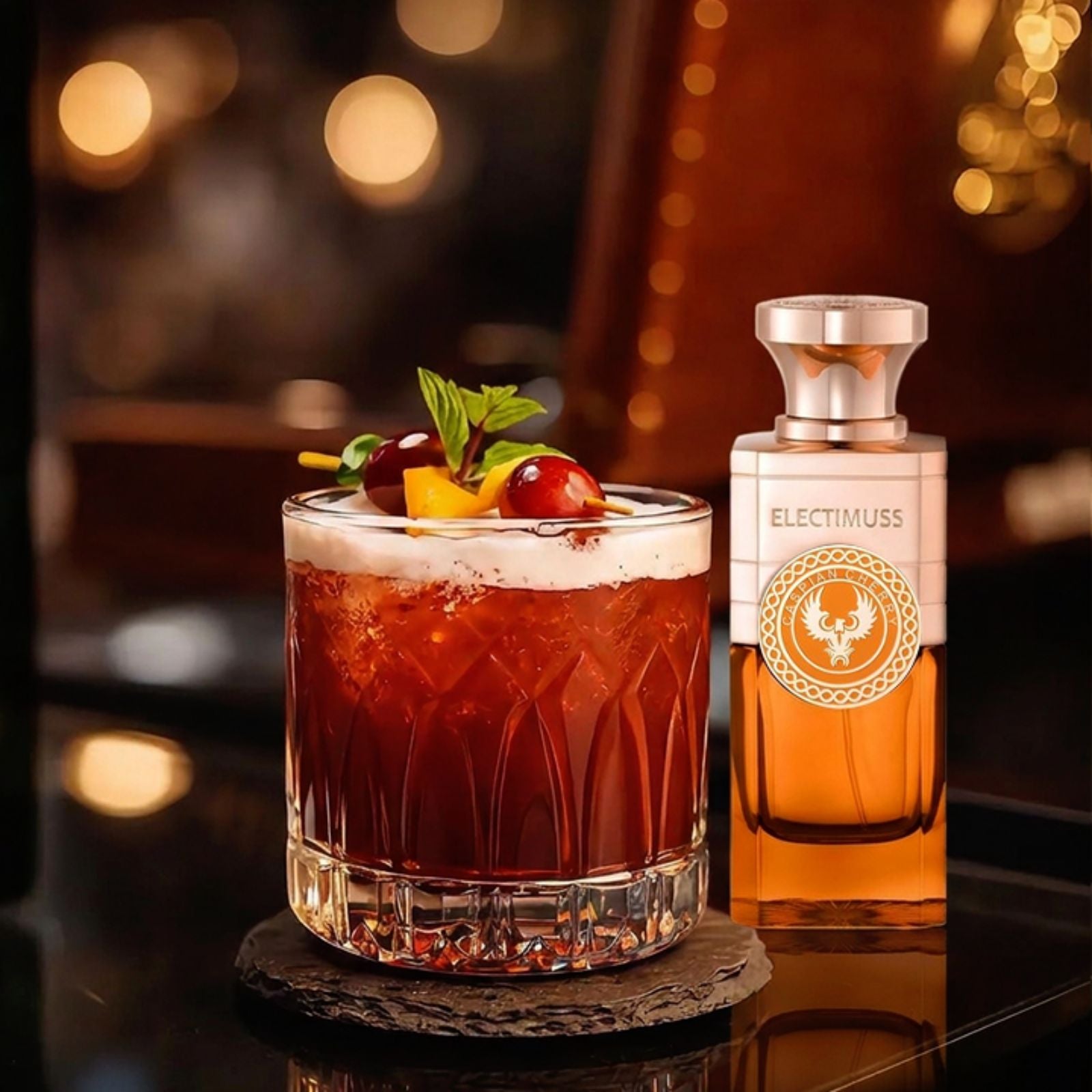 Caspian Cherry cocktail beside the Electimuss fragrance that inspired it